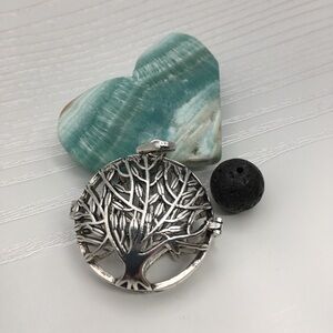 Tree of Life Aromatherapy Silver tone Locket.  Lava stone included.